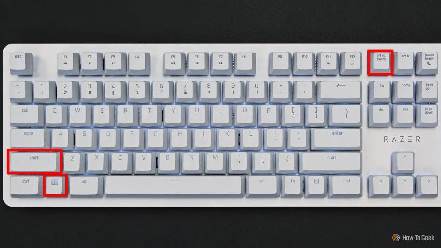 Bàn phím màu trắng với các phím Meta, Shift và Print Screen được tô đỏ, minh họa phím tắt chụp ảnh màn hình một vùng cụ thể trên Linux KDE Plasma.