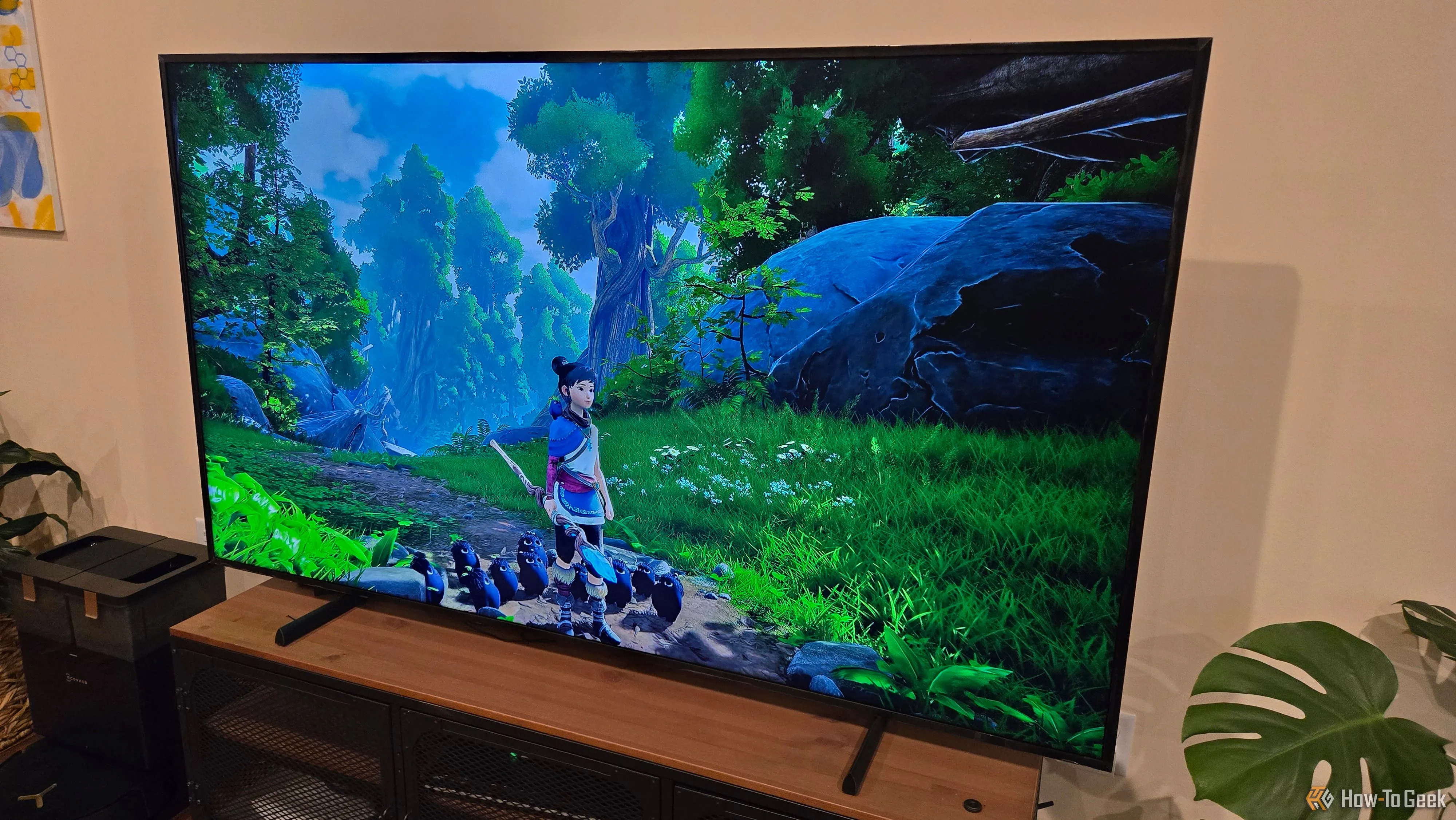 Hình ảnh game Kena: Bridge of Spirits đang được truyền phát mượt mà qua NVIDIA GeForce NOW trên màn hình Samsung Frame TV, thể hiện đồ họa sống động.