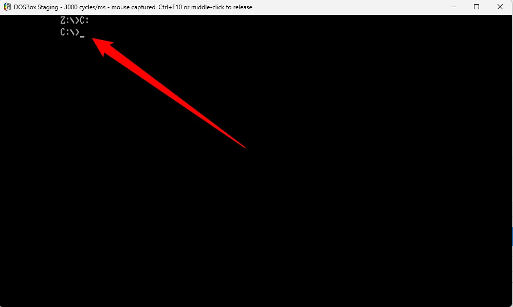 Màn hình DOSBox hiển thị lệnh C: và sự thay đổi thành công từ ổ đĩa Z: sang ổ đĩa ảo C: để quản lý tệp game.