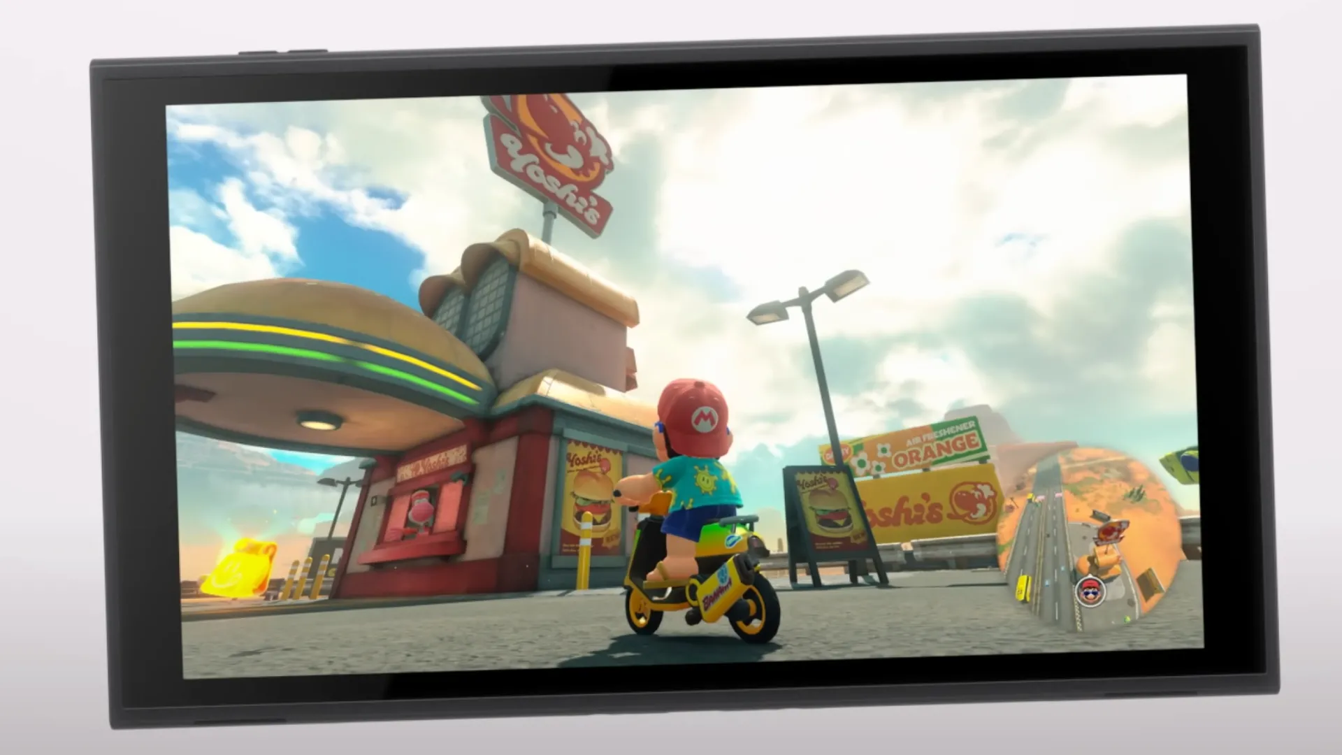 Màn hình Switch 2 hiển thị hình ảnh game Mario lái xe scooter với đồ họa sắc nét.