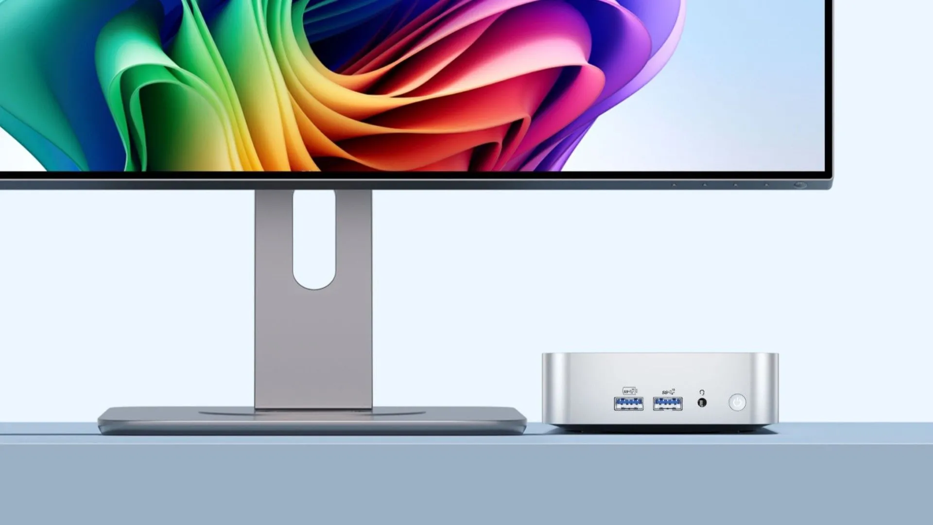 Máy tính mini GEEKOM A6 kết nối với màn hình, thể hiện sự sang trọng của vỏ nhôm và khả năng làm việc hiệu quả.