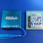 Wii Kawaii mod đặt cạnh hộp game Game Boy, minh họa kích thước siêu nhỏ gọn của console modded.